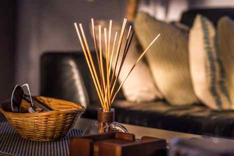 incense sticks in jar on coffee table in living room