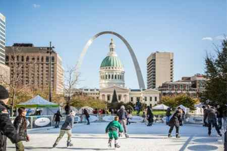 Families skate on the ice rink in downtown St. Louis during Winterfest.