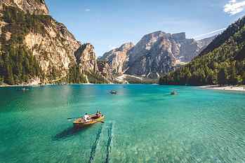 brown wooden boat, aerial photography of a body of water during daytime HD wallpaper