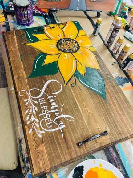 paint party idea - paint a noodle board with hand painted sunflower and stenciled words 