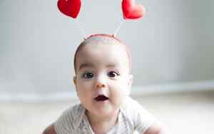 Baby wearing a heart headband