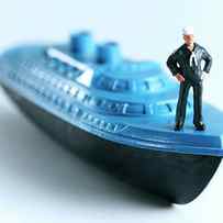 Man Standing on Blue Ship by CSA Images