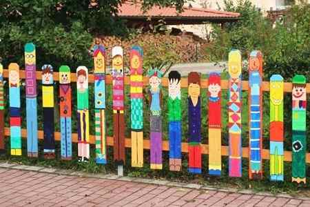 Brightly coloured fence people