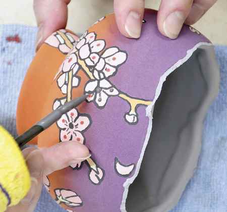 12 Add glossy glaze details to prepare for luster additions after the glaze firing.