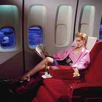 Model Wearing Pink Jacket On Airplane by Horst P. Horst