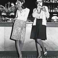 Models Wearing Cloche Hats At A Bar by Kourken Pakchanian