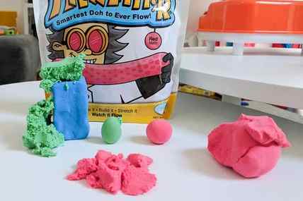 Mad Mattr play dough in several colors, sculpted into several shapes, on a white counter.