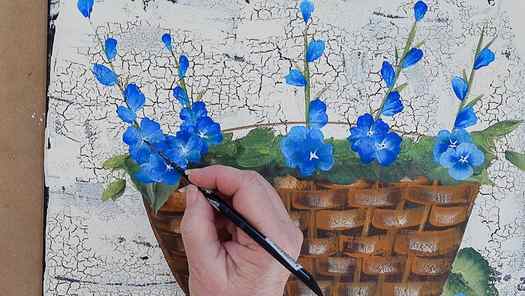 basket painted in acrylics with leaves and stems