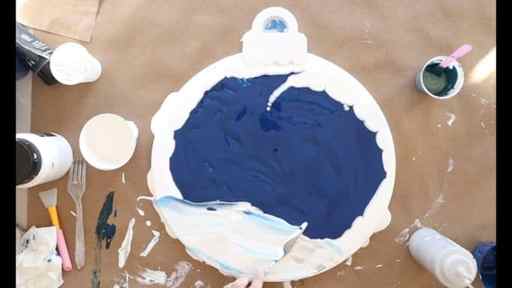 how to paint snow, bring in the snow drifts and snowy ground by swiping white paint with a palette knife over the dark blue night background