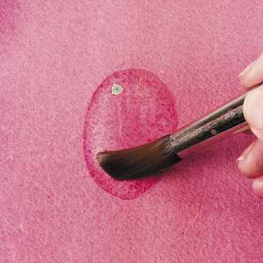 Use a brush to lift the watercolor paint