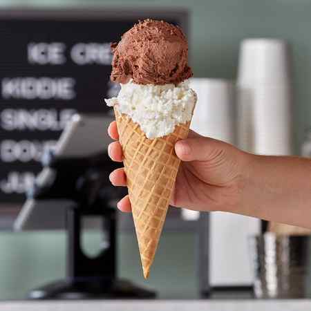 A waffle cone with ice cream in it