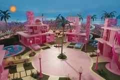The Barbie movie set. It shows a series of four Palm Springs inspired buildings, painted in bright pink, with no doors or walls.