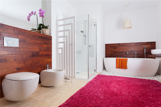 Modern bathroom with dark wood accents and a large magenta rug