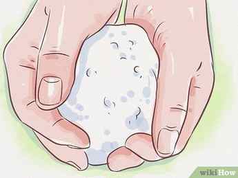 Step 1 Pack a snowball with your hands for the bottom section.
