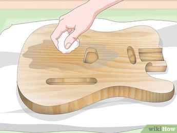 Step 3 Apply wood sealer to the guitar.