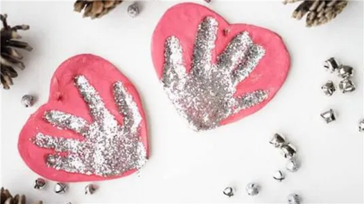 Two salt dough handprints with silver glitter.