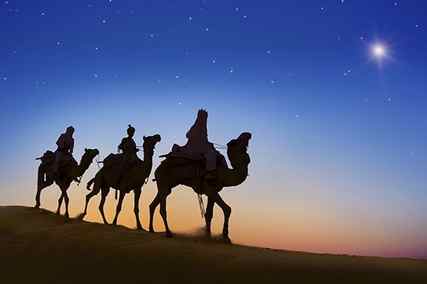 three wise men on camels using the star of bethlehem to navigate