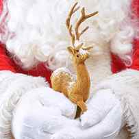 Santa Holding Reindeer Figure by Amanda Elwell