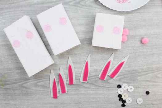 adding pink circles to scrap wood & ear supplies