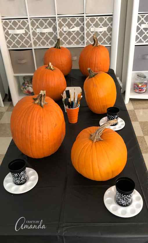 pumpkins on table ready to be painted